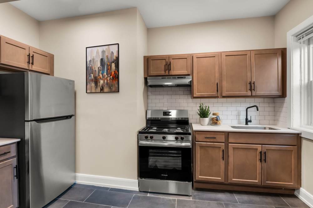 Kitchen with cabinets at Detroit Living in Detroit, Michigan