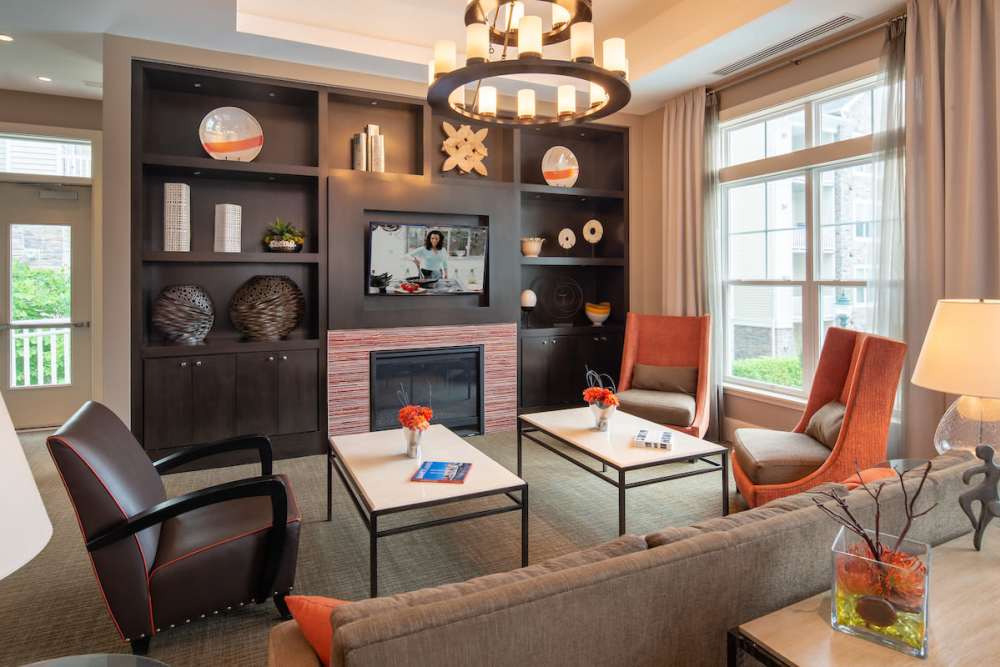 Community clubhouse with lots of seating area at The Elms at Clarksburg Village in Clarksburg, Maryland