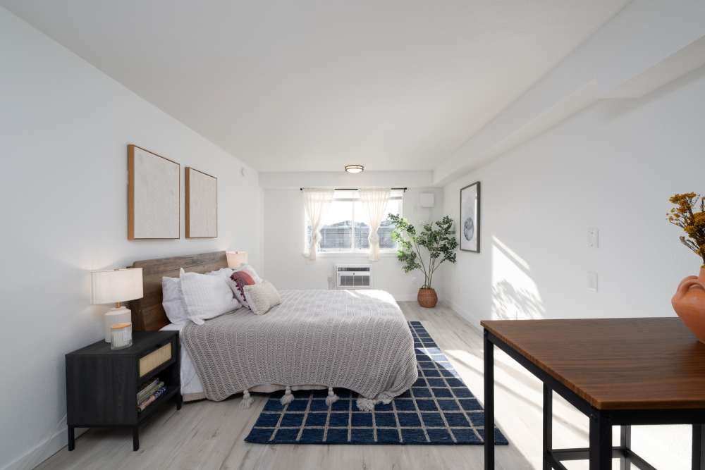 Bright bedroom with walk-in closet at Pinnacle Point Apartments in Fife, Washington  