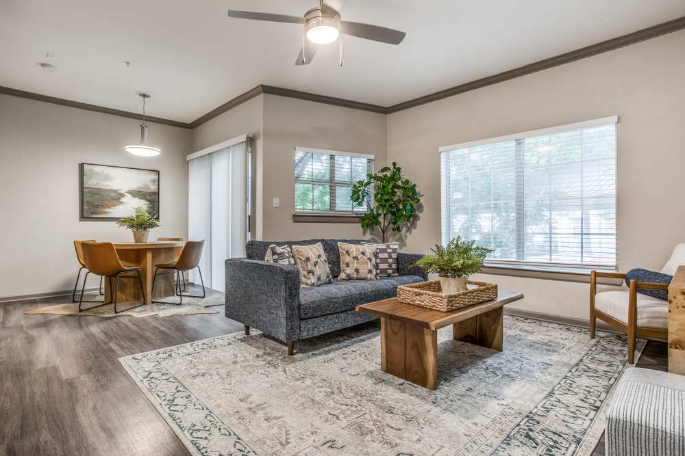 Living room with ceiling fan and couch at Canyon Ridge in Austin, Texas