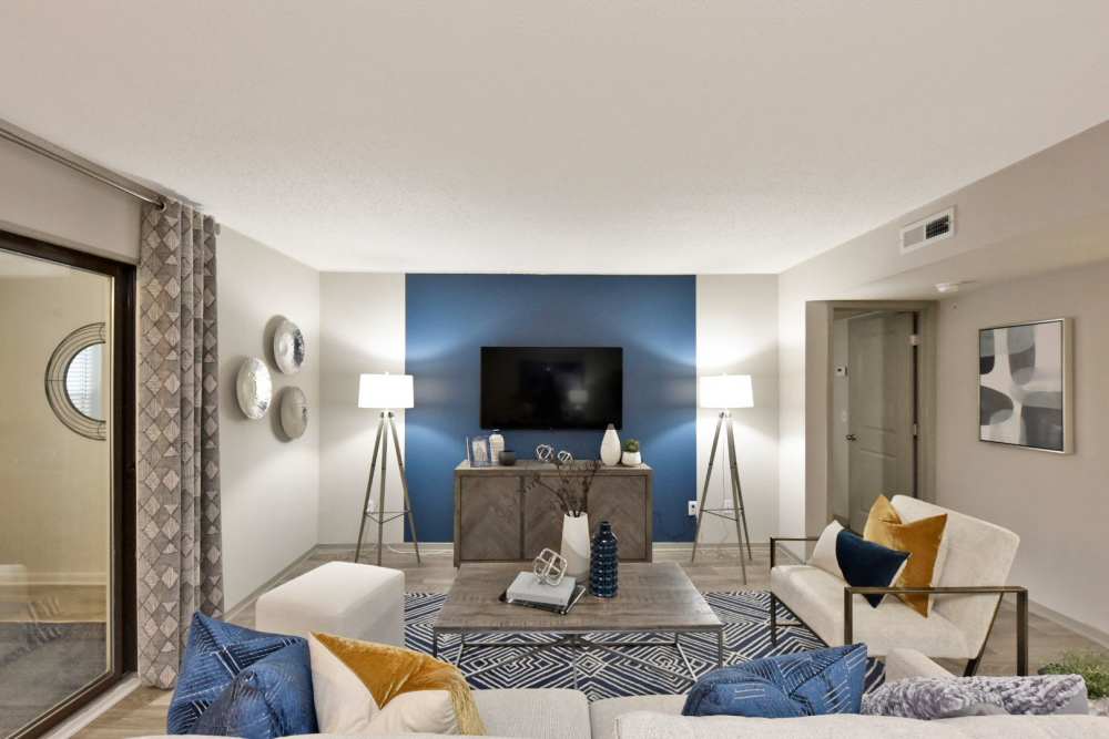 Charming living room with ambient lighting and white furniture at Arcadia Creekside in Chattanooga,Tennessee