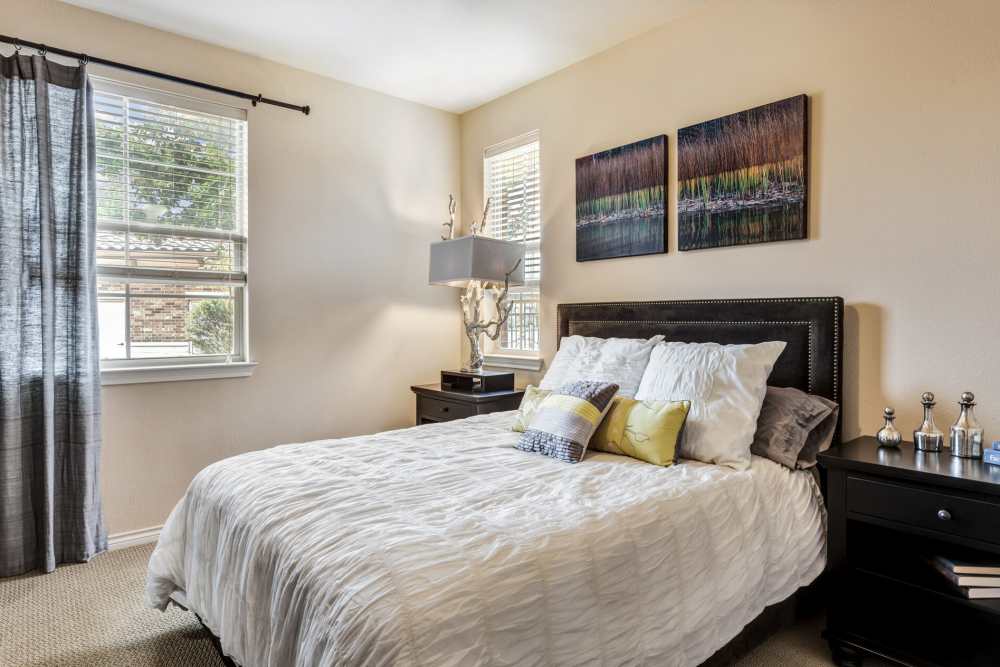 Cozy bedroom with comfortable bed at Renaissance At North Park in Lubbock, Texas