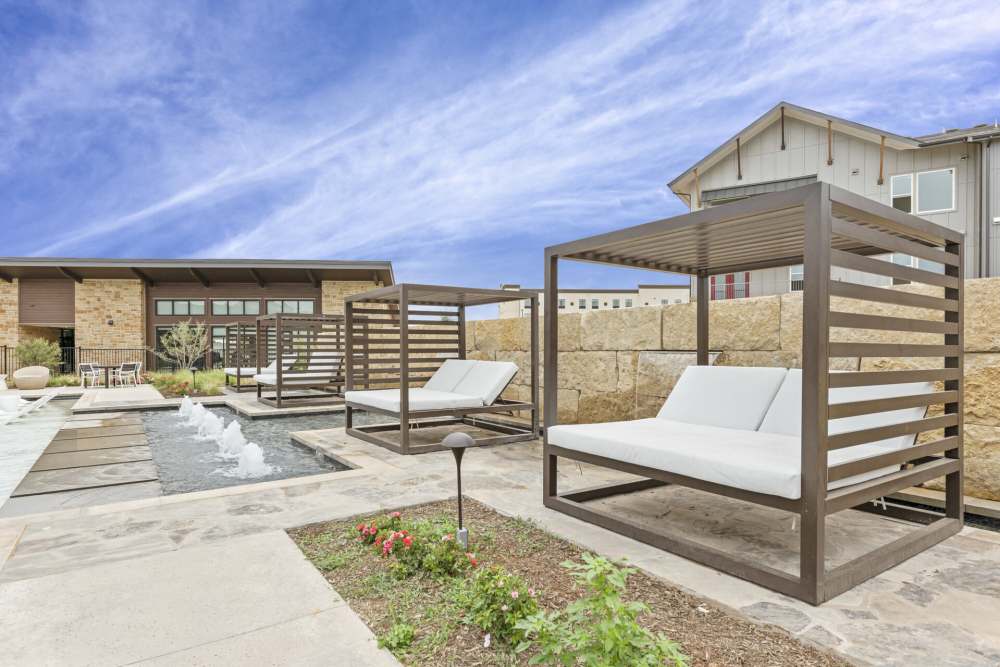 Outdoor poolside lounge at Slide North Apartments in Lubbock, Texas