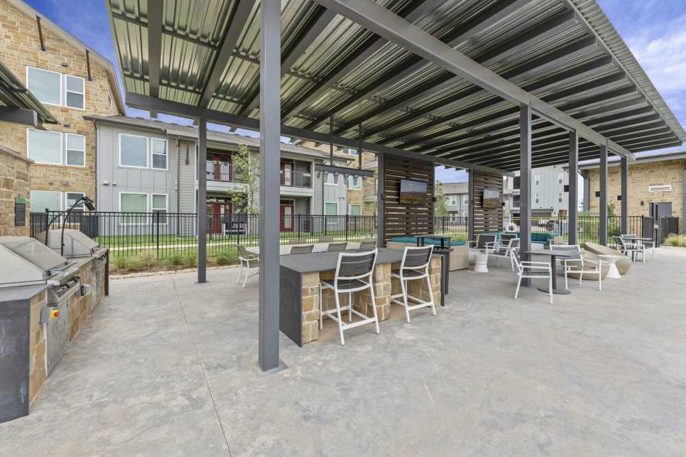Outdoor BBQ area at Slide North Apartments in Lubbock, Texas