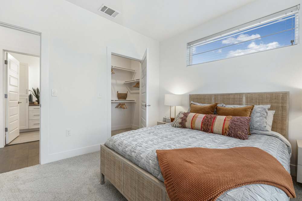Bedroom with a walk-in closet at Slide North Apartments in Lubbock, Texas