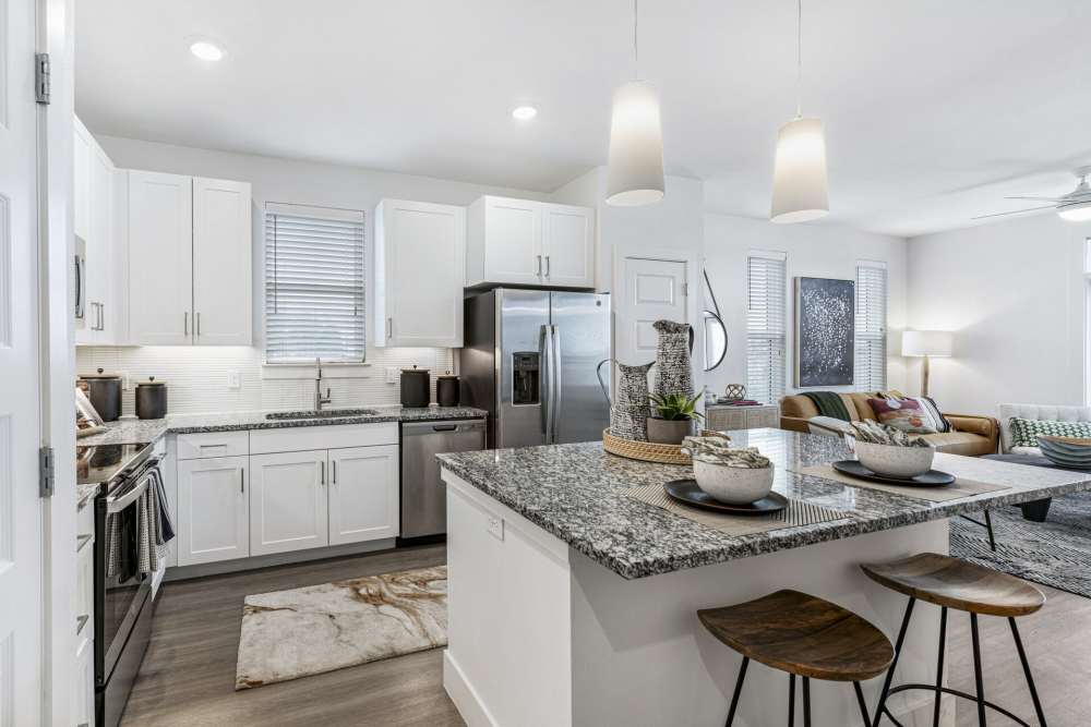 White storage cabinetries in a kitchen at Slide North Apartments in Lubbock, Texas