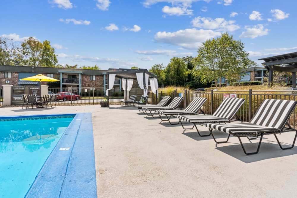 Lounge chairs by the pool at The Grove At Hickory Valley in Chattanooga, Tennessee