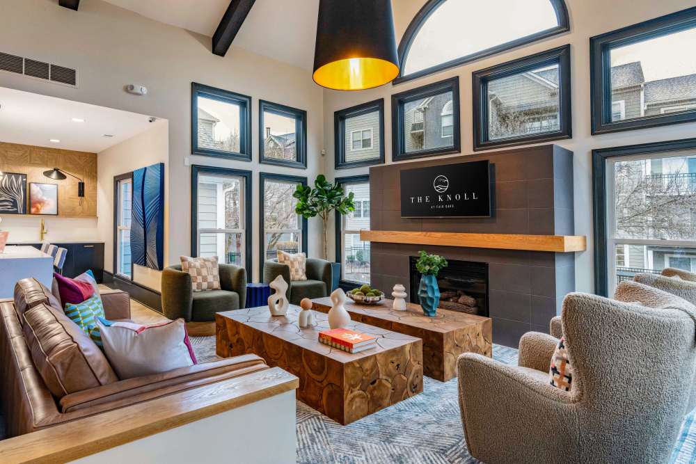 Clubhouse lounge with fireplace at Knoll at Fair Oaks in Fairfax, Virginia