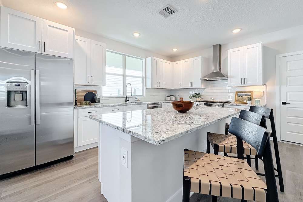 Kitchen with energy-efficient appliances at BB Living Wellen Park in Venice, Florida