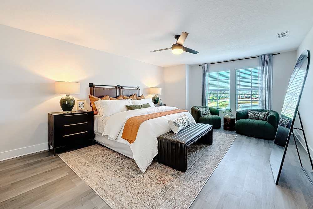 Bedroom with expansive window at BB Living Wellen Park in Venice, Florida