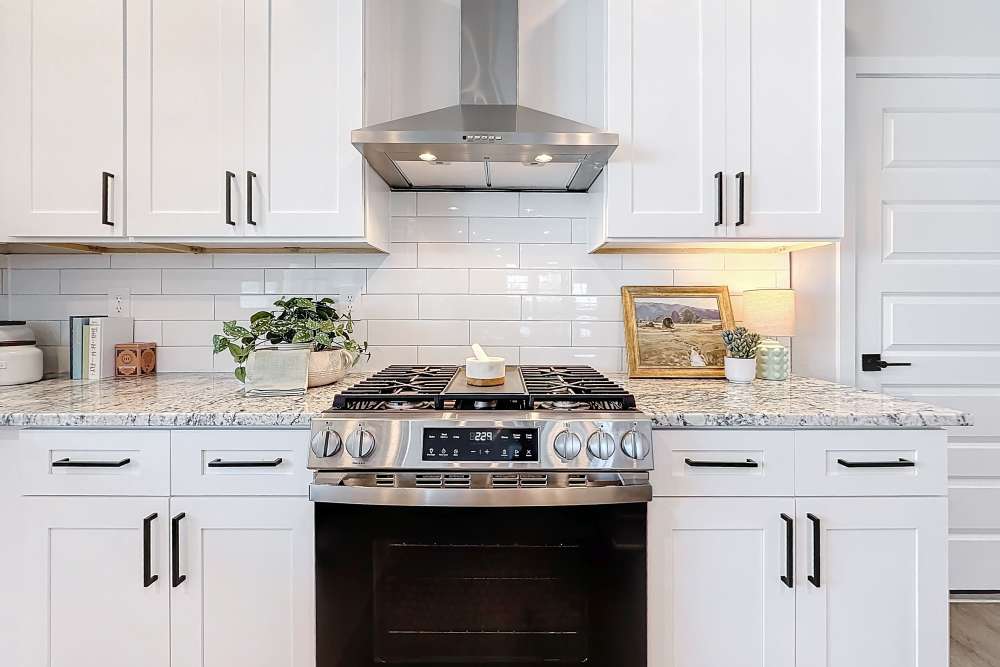Kitchen with stainless steel appliances at BB Living Wellen Park in Venice, Florida