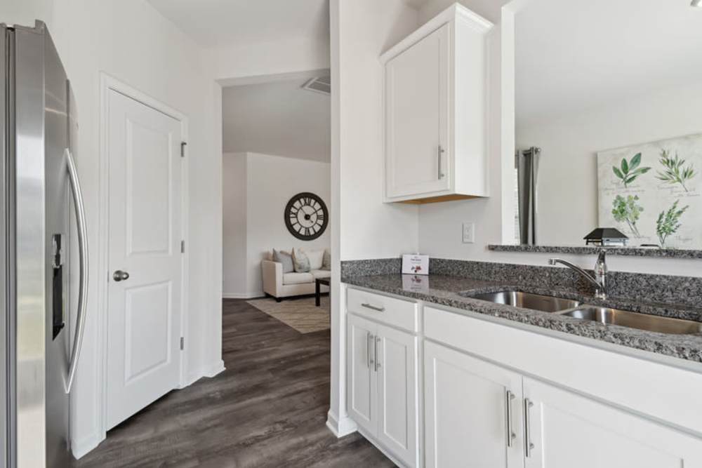 Apartment kitchen with fridge at Norman Ridge Townhomes in Terrell, North Carolina