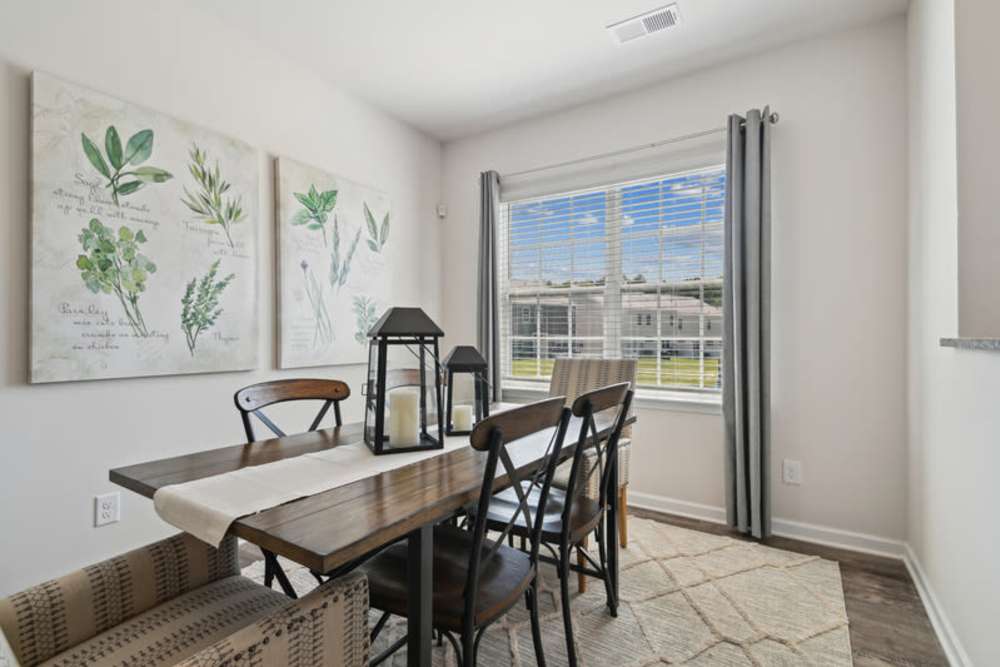Dining room with dining table at Norman Ridge Townhomes in Terrell, North Carolina
