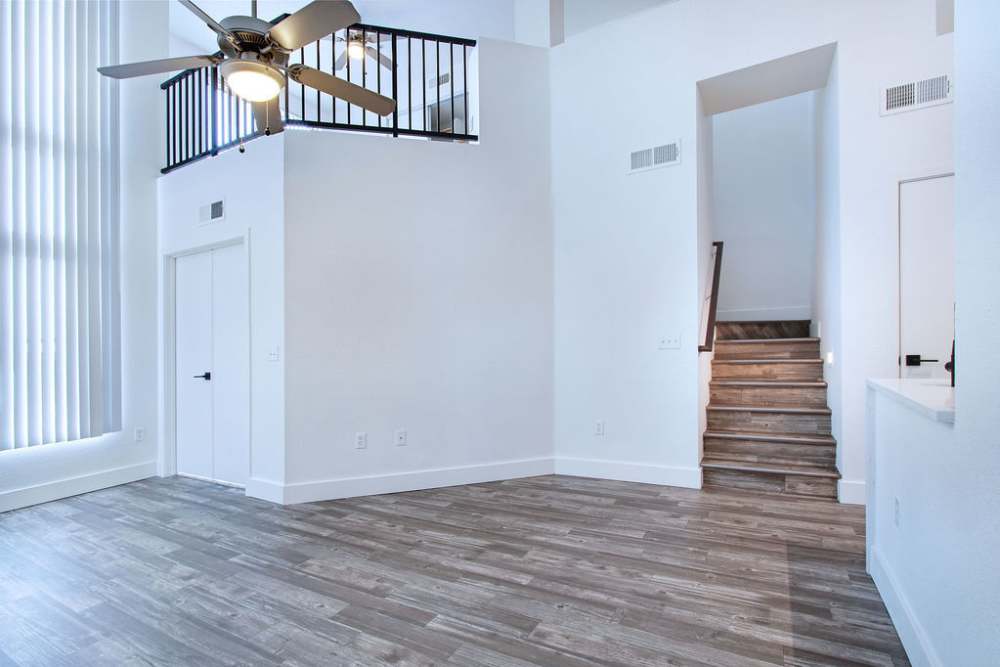Living room with wood-style floors at Ninety Degrees in Phoenix, Arizona
