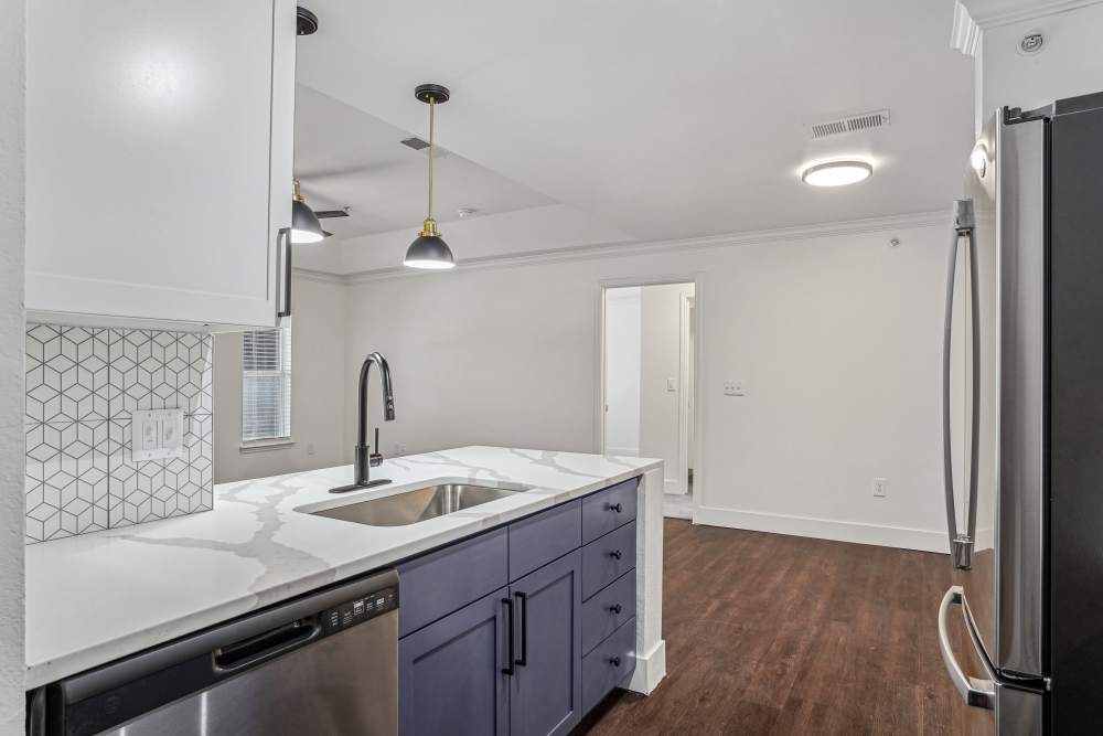 Kitchen with appliances at Cypress in McKinney, Texas