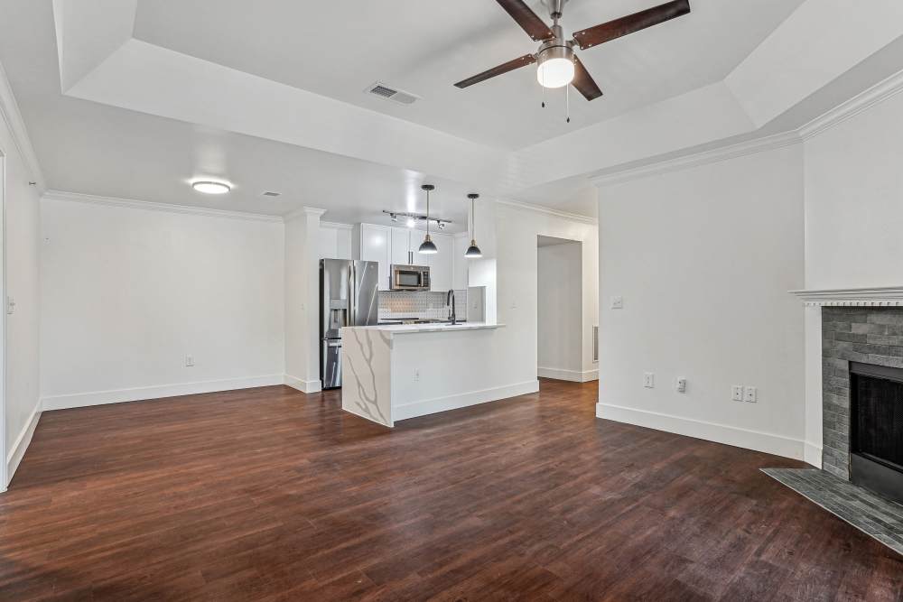 Spacious living room with wood flooring at Cypress in McKinney, Texas