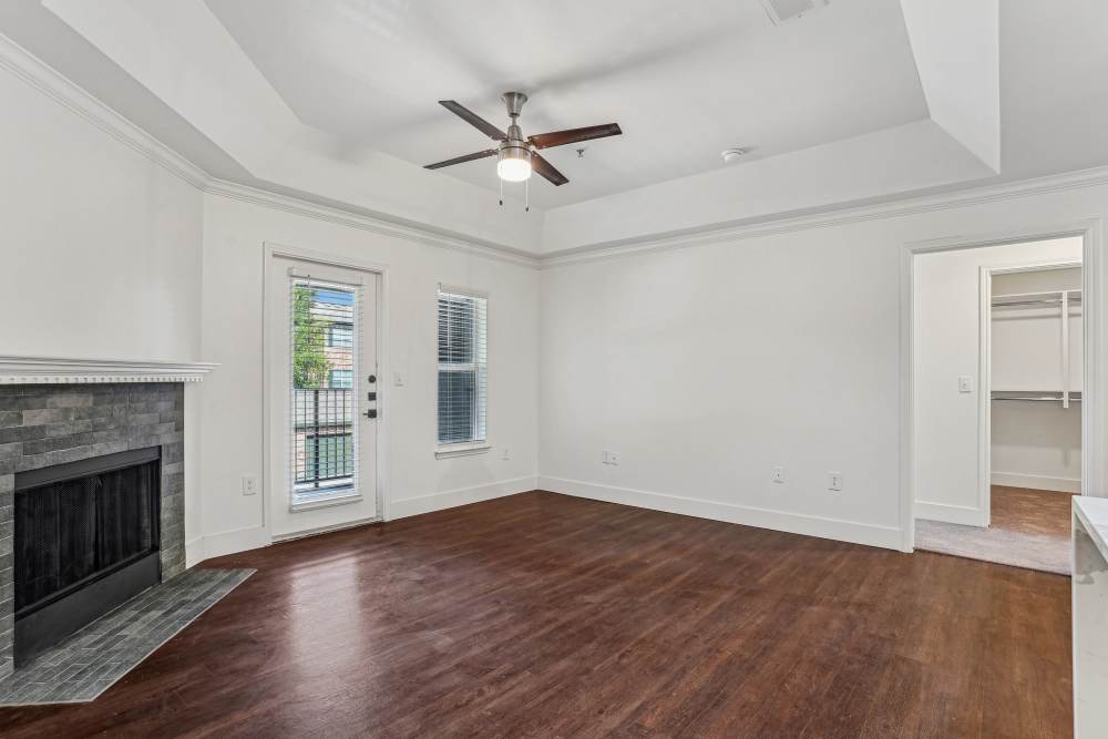 Ceiling fan and firepit in the living room at Cypress in McKinney, Texas