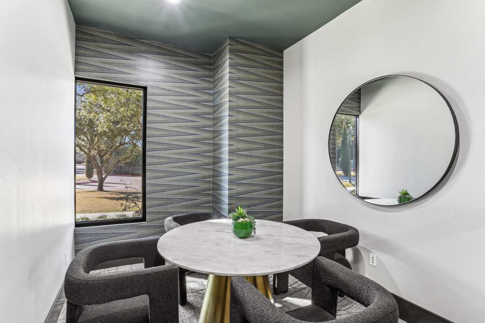Sitting area with round table at Cypress in McKinney, Texas