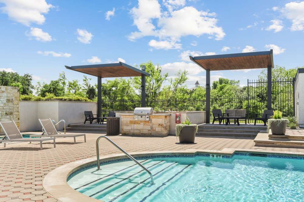 Relaxing chairs near pool at Milan in Austin, Texas