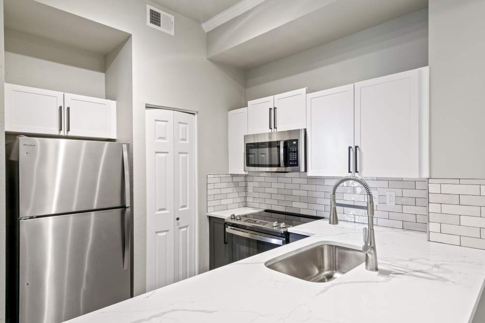 Kitchen with backsplash at Milan in Austin, Texas