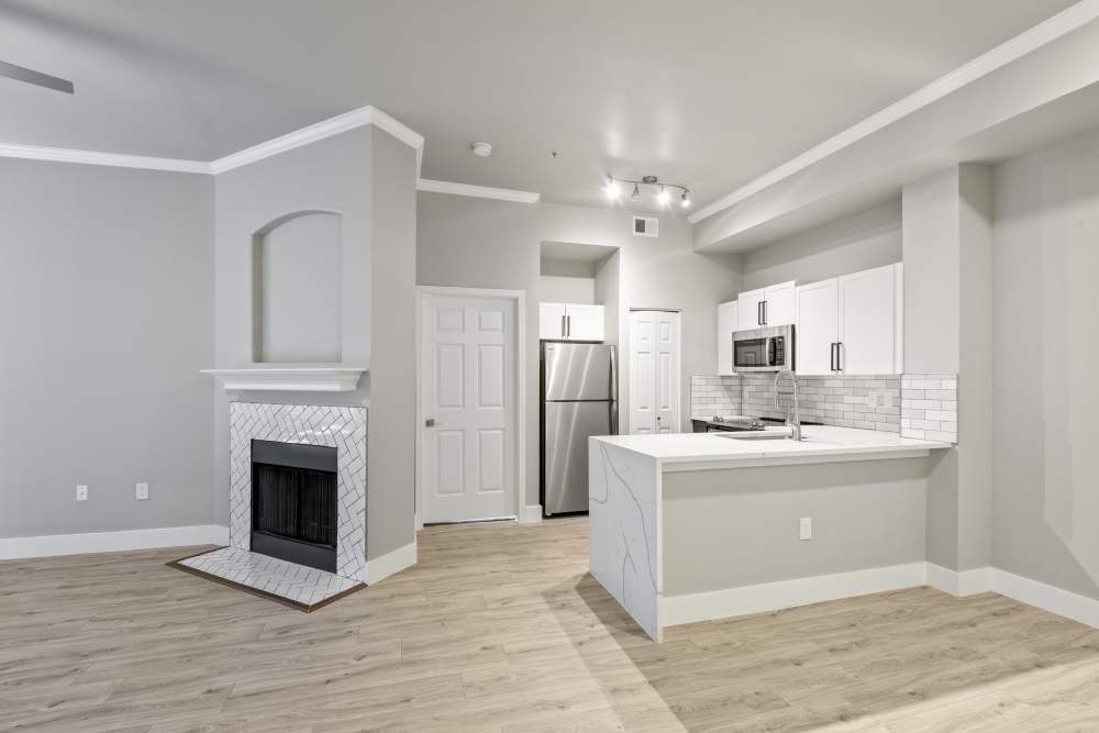 Unfurnished room with firepit attached at Milan in Austin, Texas