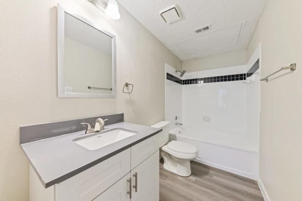 Bright bathroom with shower and tub at Benton in Dallas, Texas, 