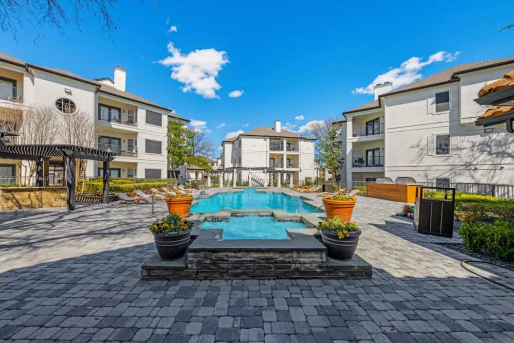 Vieew of swimming pool and lounge beds at Benton in Dallas, Texas, 