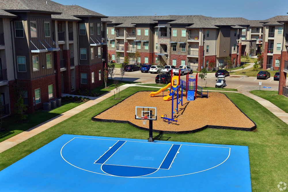 Basketball court and playground at 35 West in Moore, Oklahoma