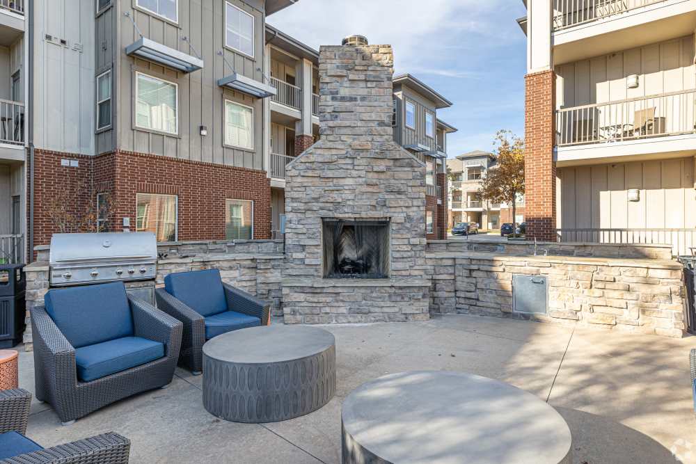 Outdoor fireplace and cozy chairs at 35 West in Moore, Oklahoma