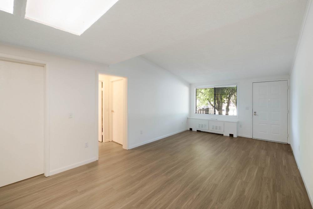 Living room with hardwood floor at The Flats at Lakeshore in Fort Oglethorpe, Georgia