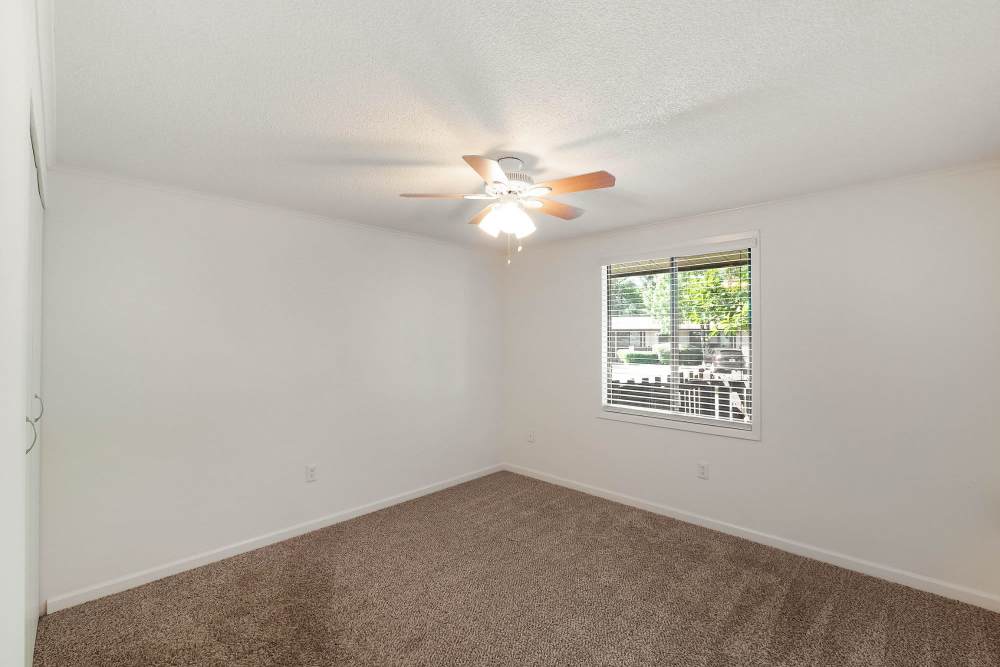 Bedroom with ceiling fan at The Flats at Lakeshore in Fort Oglethorpe, Georgia