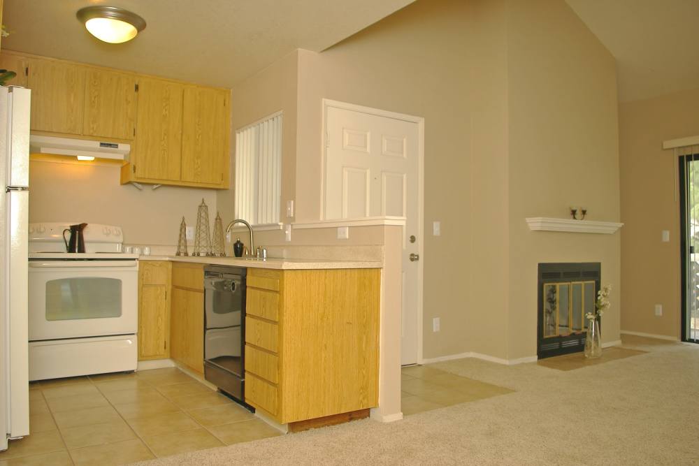 Apartment kitchen with storage cabinetries at Twin Creeks in Antioch, California
