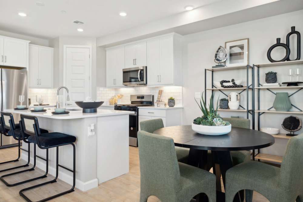 Kitchen and dining table in a model home at BB Living Desert Ridge in Phoenix, Arizona