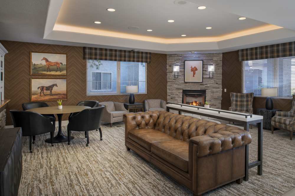A room with a couch and a fireplace at Ridge at the Stratford in Phoenix, Arizona