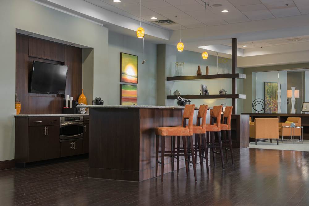 Clubhouse with a television at Crescent Centre Apartments & Townhomes in Louisville, Kentucky