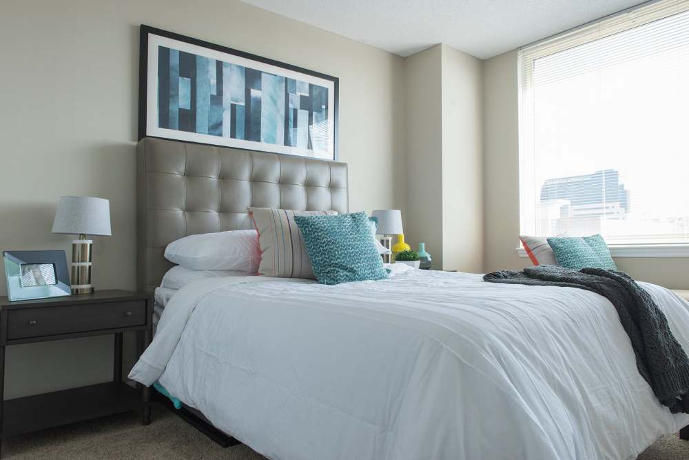 Comfy bedroom at Crescent Centre Apartments & Townhomes in Louisville, Kentucky