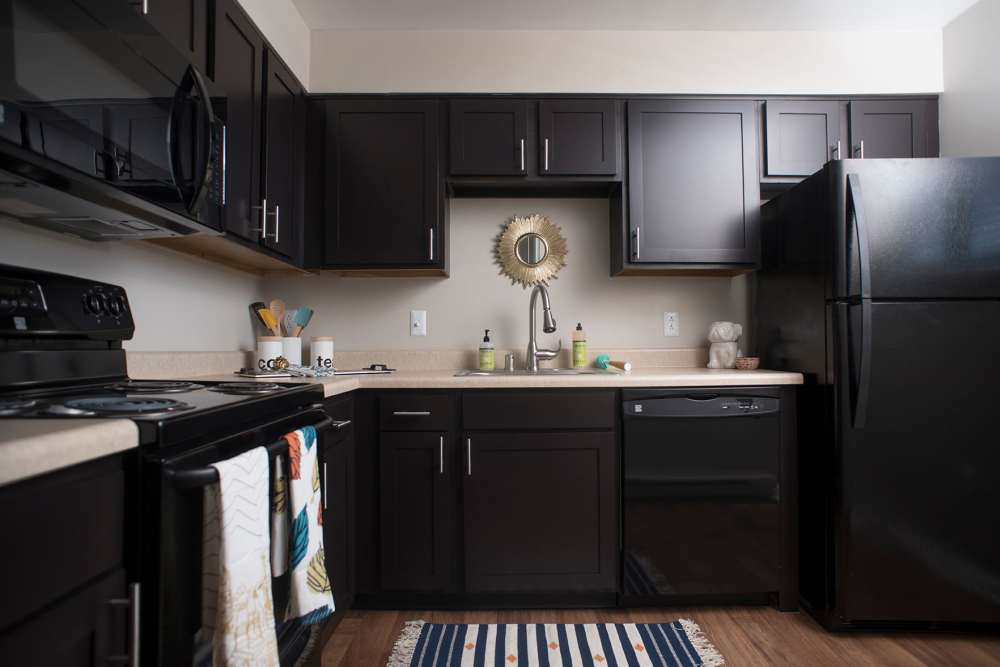 Kitchen with cabinets at Crescent Centre Apartments & Townhomes in Louisville, Kentucky