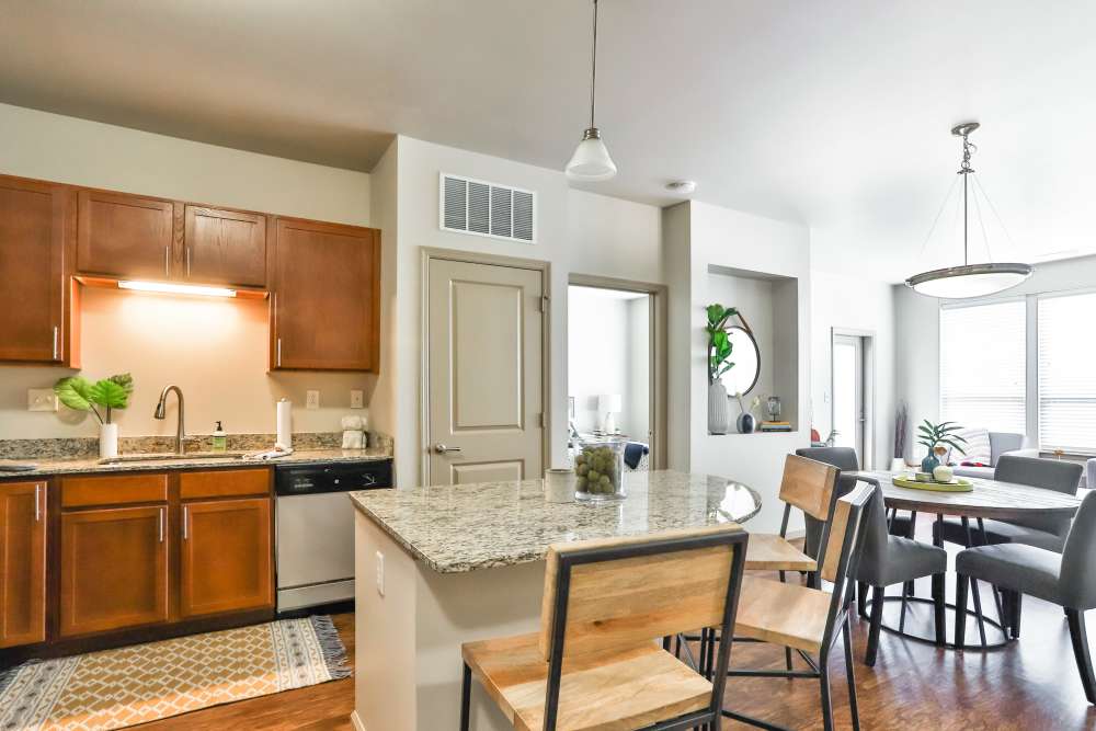 Kitchen with breakfast island at Residences at The Streets of St. Charles Apartment Homes in Saint Charles, Missouri