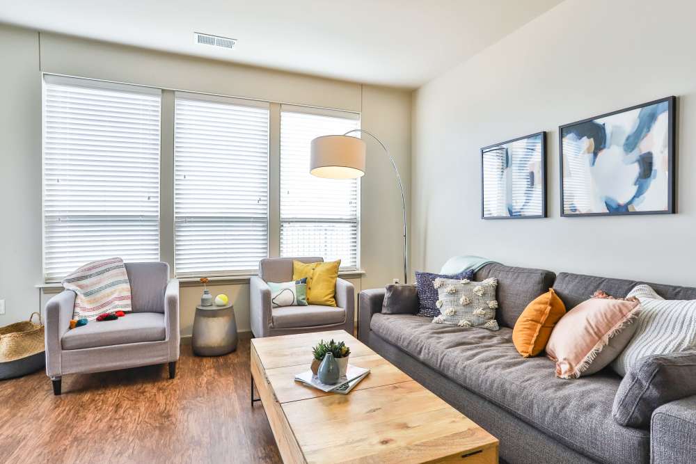 Living room with large window at Residences at The Streets of St. Charles Apartment Homes in Saint Charles, Missouri