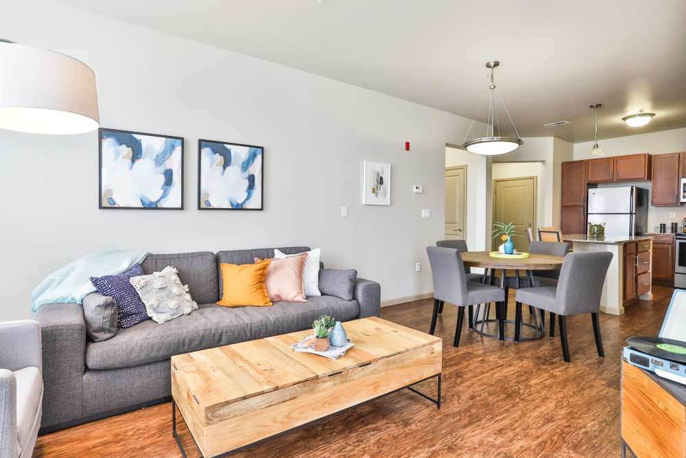 Living room with coffee table at Residences at The Streets of St. Charles Apartment Homes in Saint Charles, Missouri