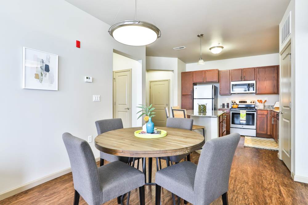 Dinning area with view to kitchen at Residences at The Streets of St. Charles Apartment Homes in Saint Charles, Missouri