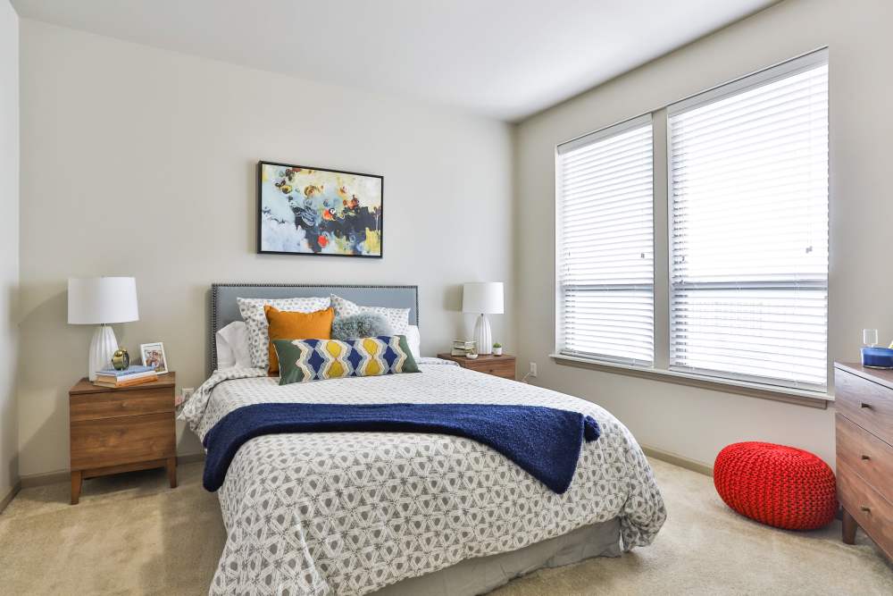 Bedroom with side lamps at Residences at The Streets of St. Charles Apartment Homes in Saint Charles, Missouri