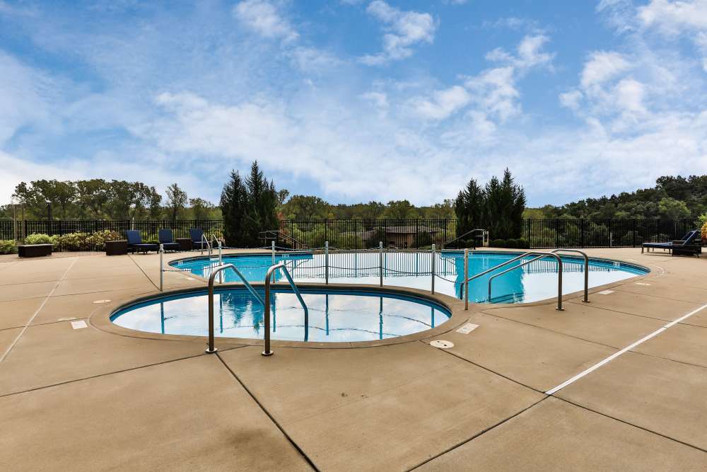 Swimming pool with spa  at Residences at The Streets of St. Charles Apartment Homes in Saint Charles, Missouri