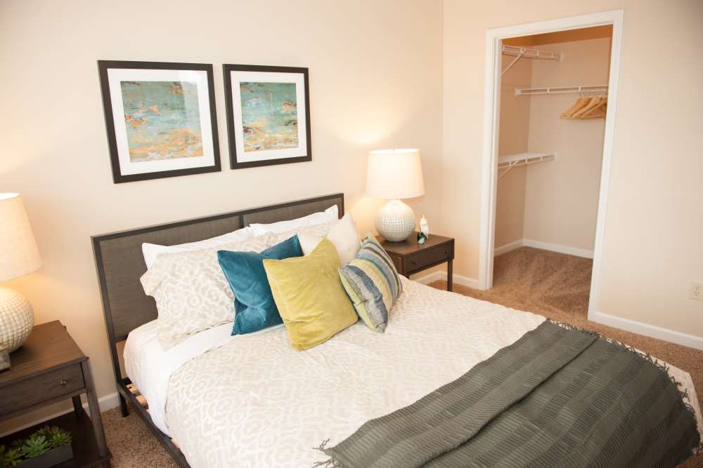 Apartment bedroom with spacious bed at Waterford Place Apartments & Townhomes in Memphis,Tennessee