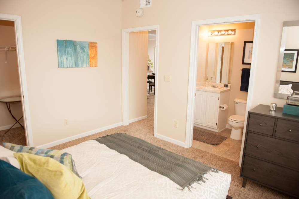 Apartment bedroom with attached bathroom at Waterford Place Apartments & Townhomes in Memphis,Tennessee