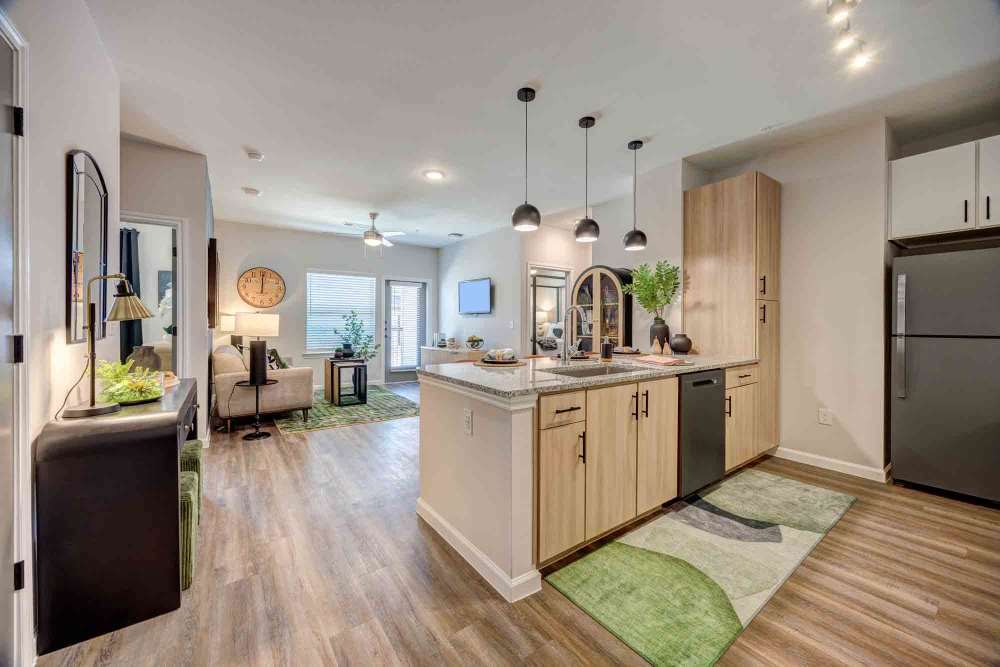 Kitchen island with light wood cabinets at The Abbey at Veramendi in New Braunfels, Texas