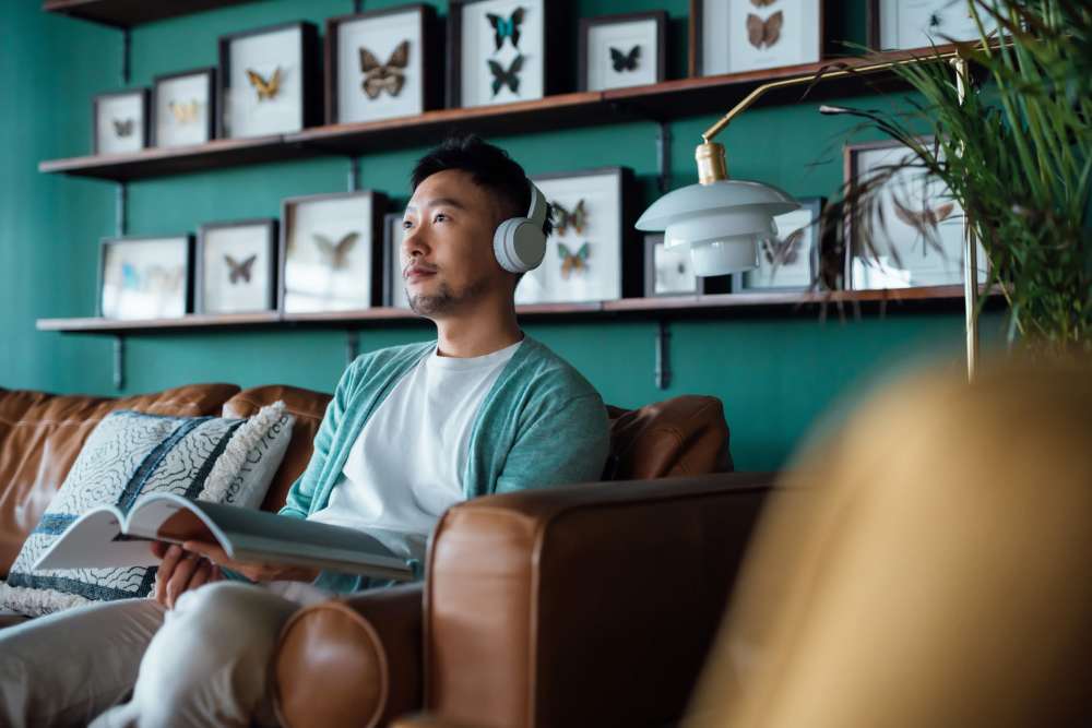Man listing to music at Detroit Living in Detroit, 
