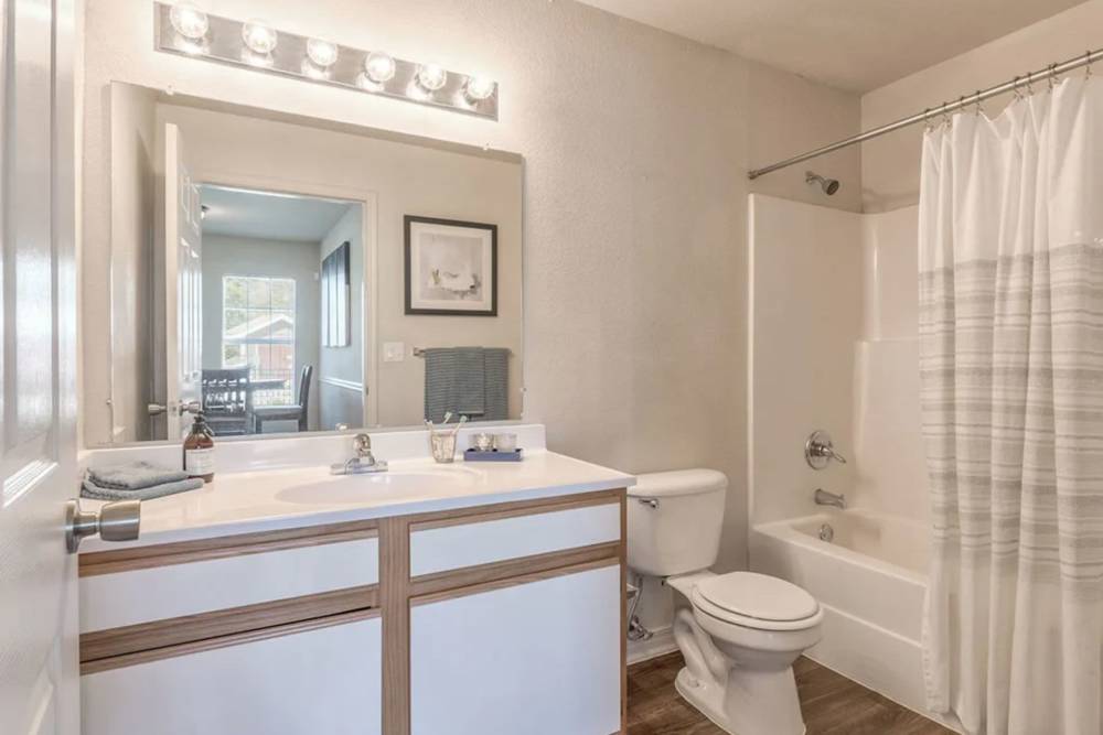 Bathroom with great lighting at Villas at Bailey Ranch Apartment Homes in Owasso, Oklahoma