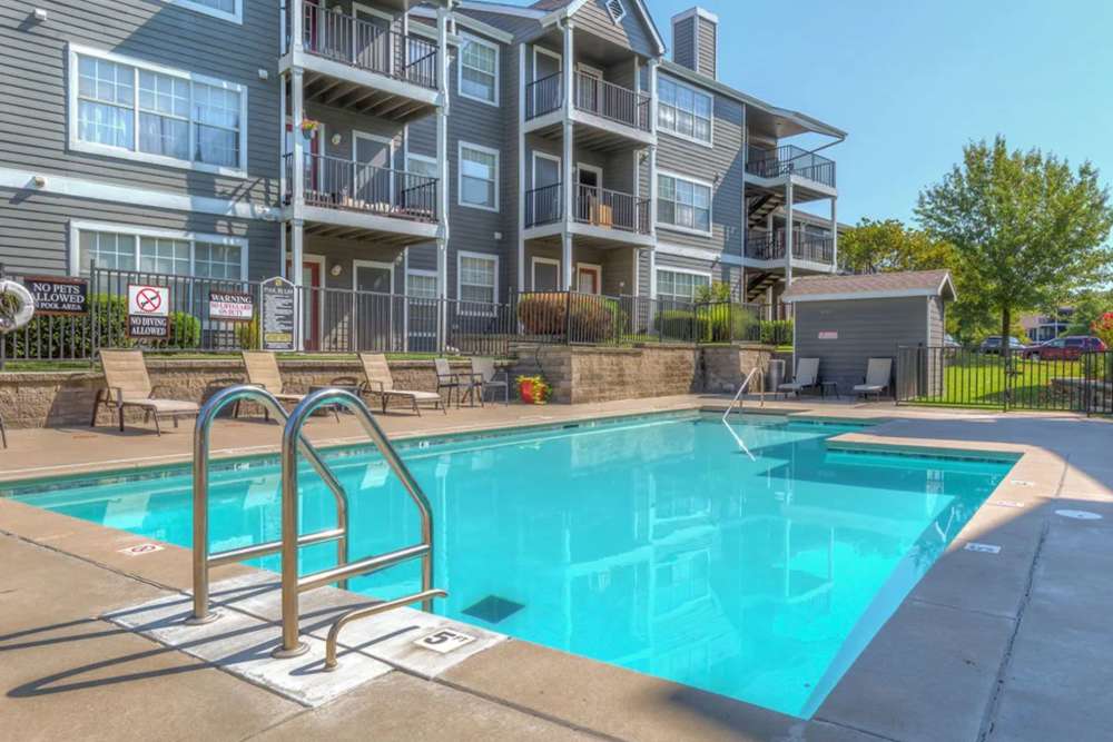 Lounge poolside at Villas at Bailey Ranch Apartment Homes in Owasso, Oklahoma