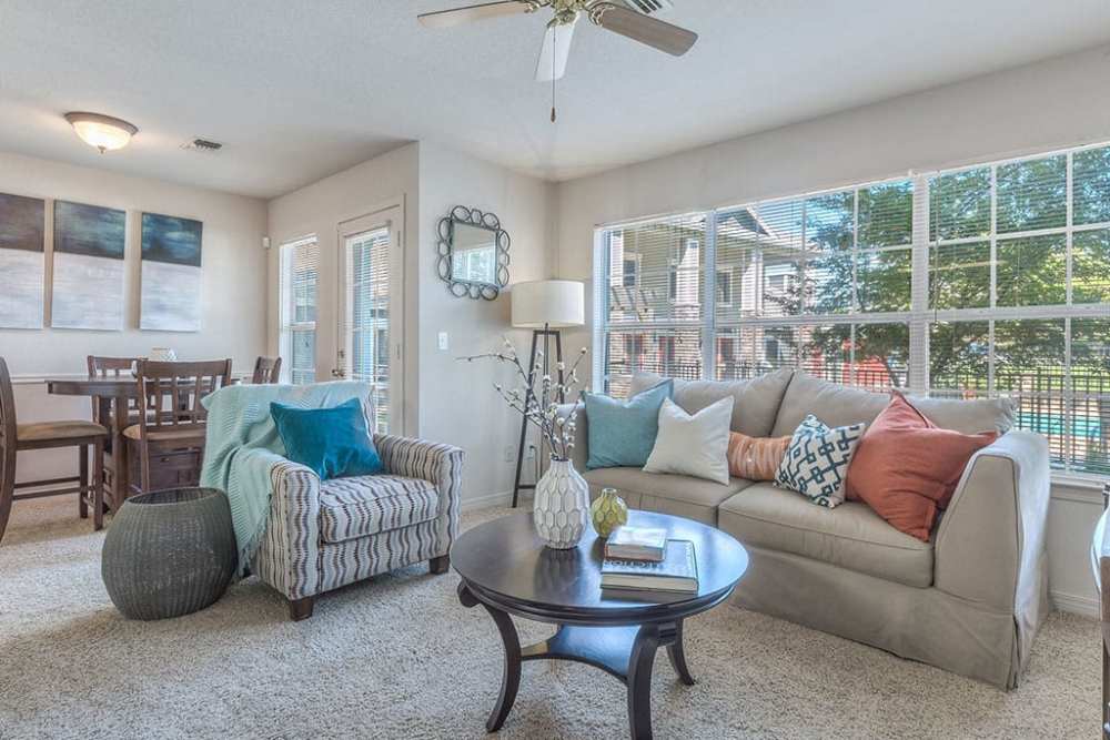 Living space with plush carpeting at Villas at Bailey Ranch Apartment Homes in Owasso, Oklahoma